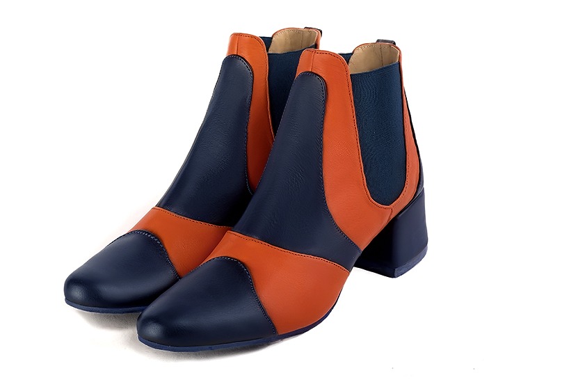 Navy blue and clementine orange women's ankle boots, with elastics. Round toe. Low flare heels. Front view - Florence KOOIJMAN